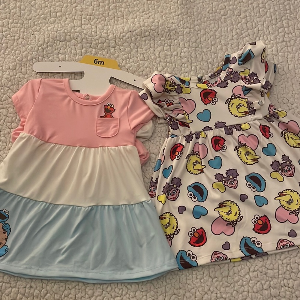 four piece Sesame Street set for little girls includes two dresses and 2 panties